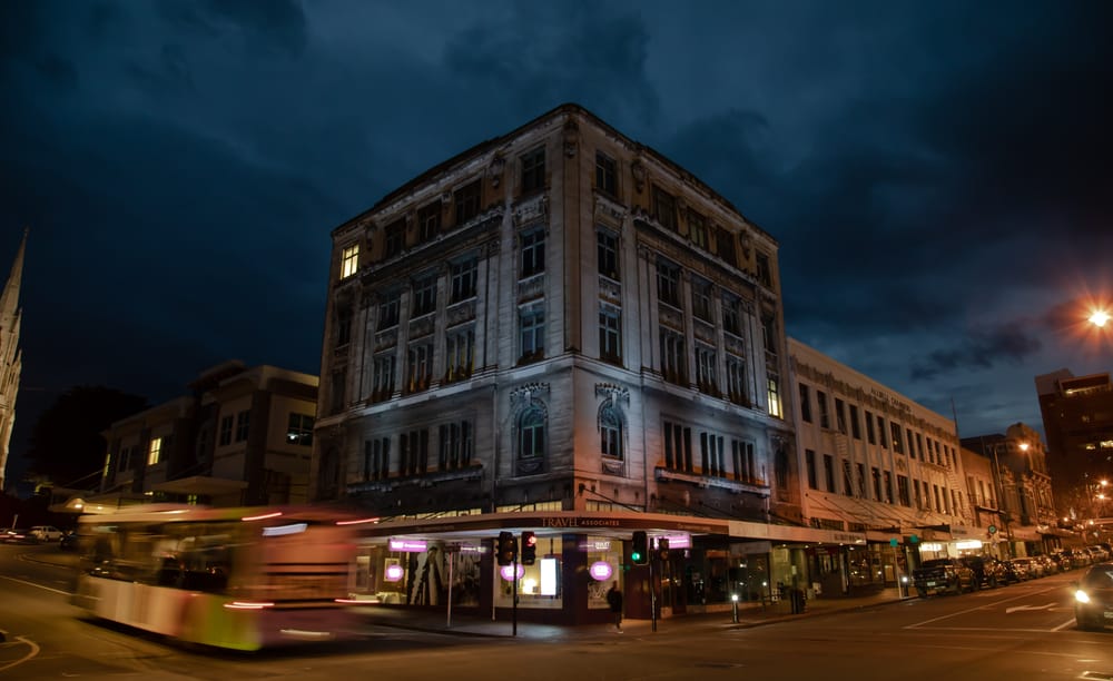 Dunedin Security Building lit up at night post image