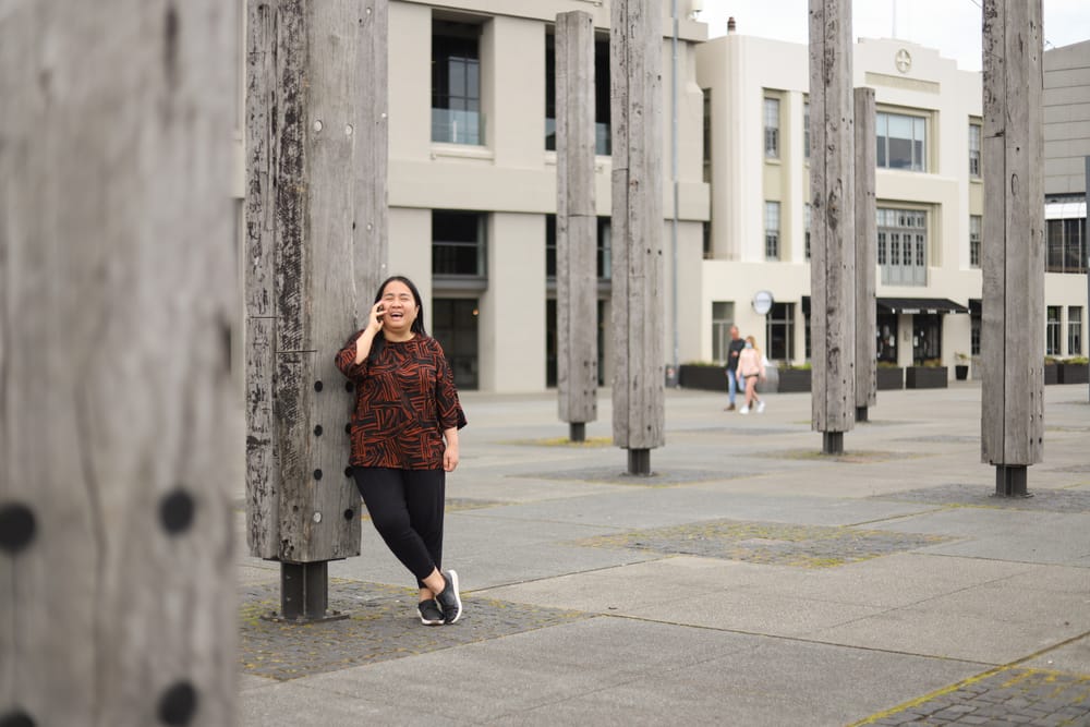 Woman talking on the phone outdoors post image