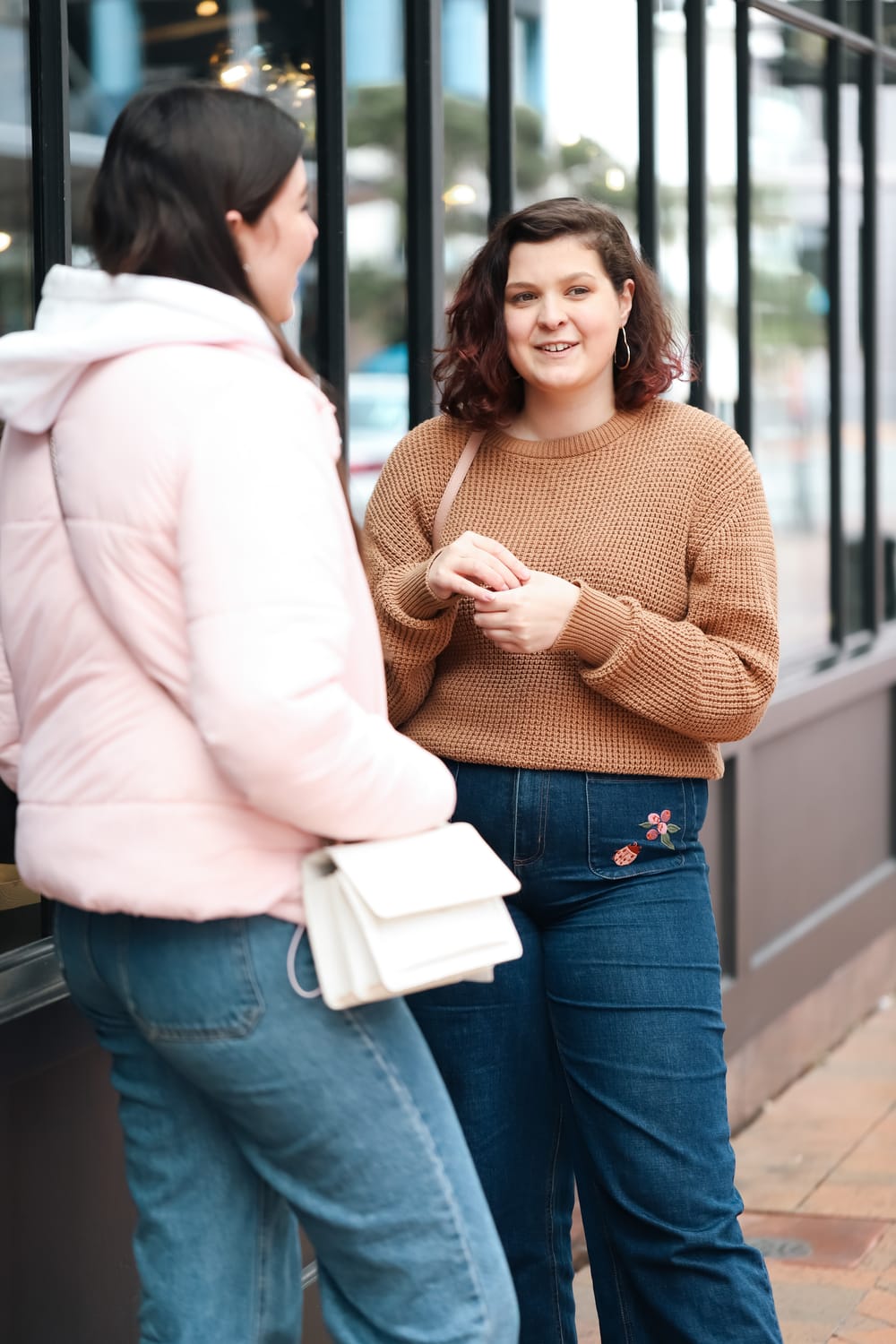 Woman smiling in conversation post image