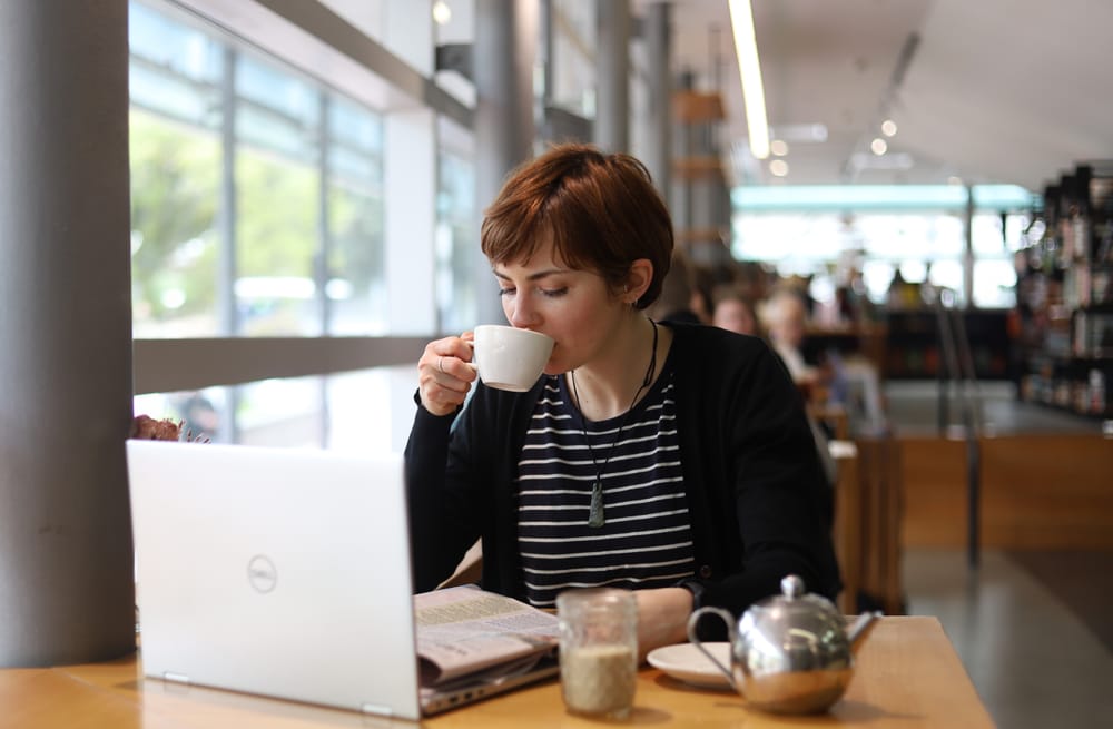 Woman drinking tea in cafe post image
