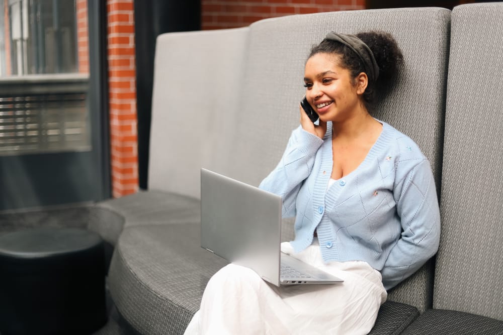 Woman smiling while on phone call post image