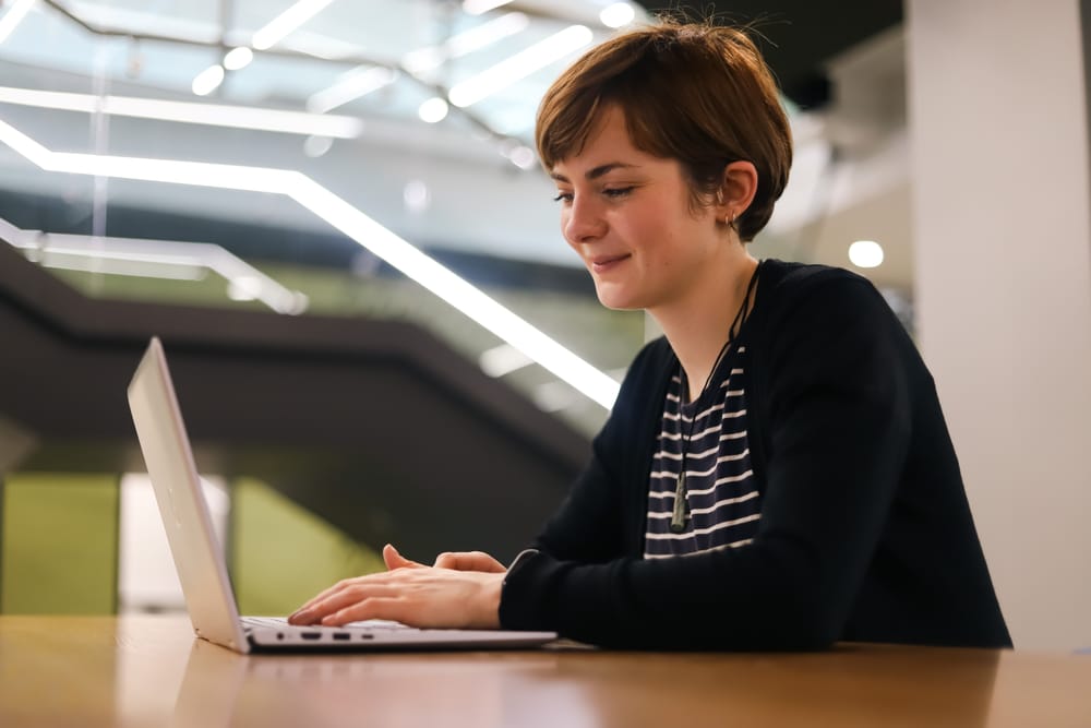 Woman typing on laptop post image
