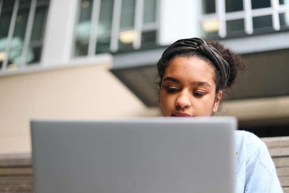 Woman working on laptop post image
