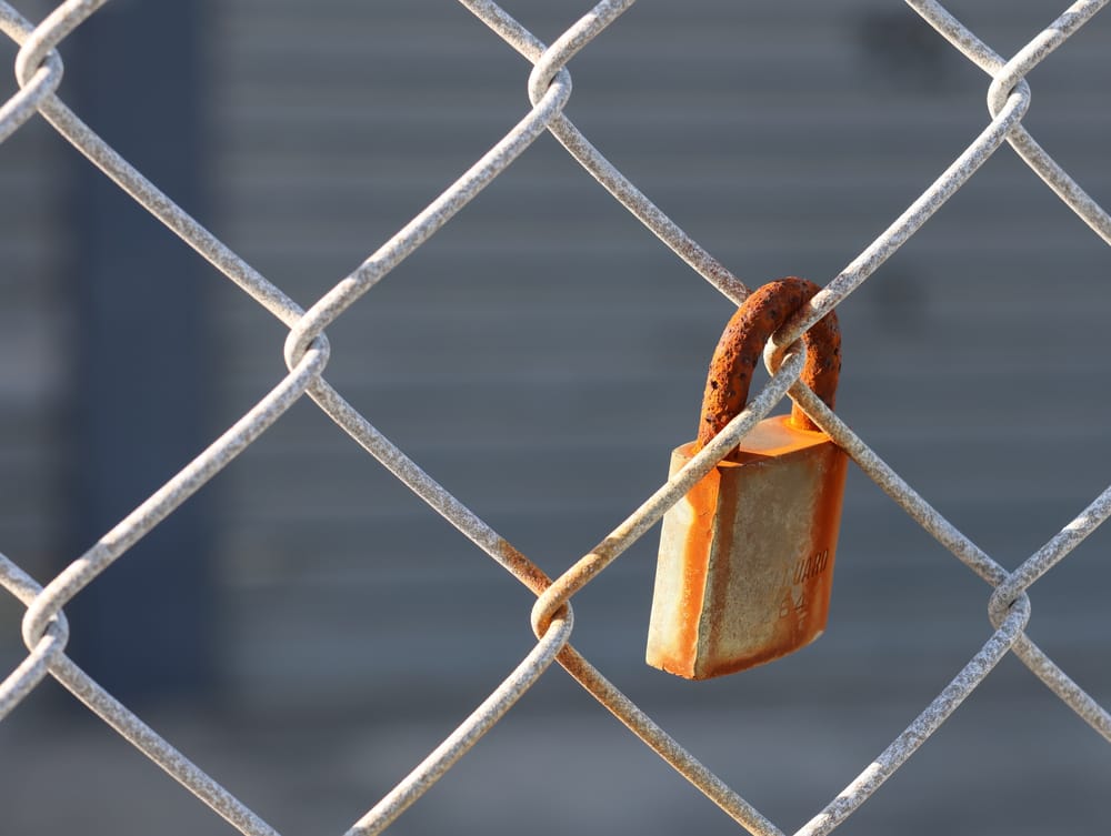 Rusted Lock on Fence post image