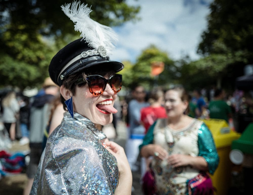 Festival participant in a silver sequin outfit post image
