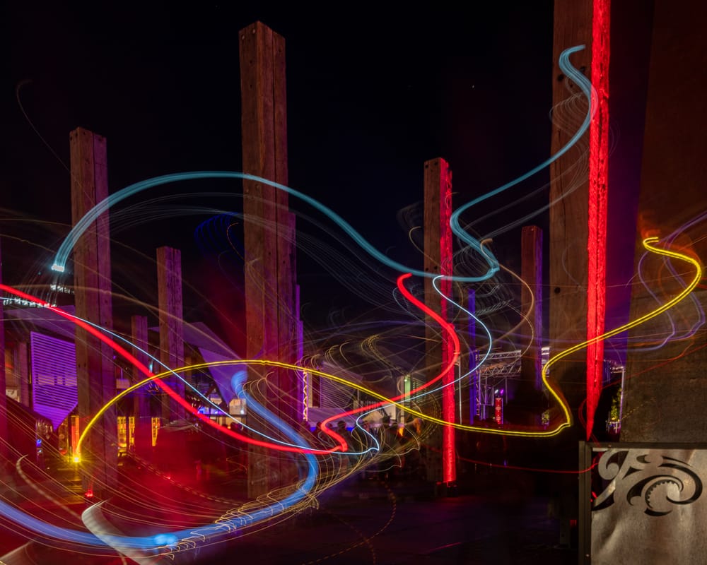 Swirly lights along the pillars at night post image