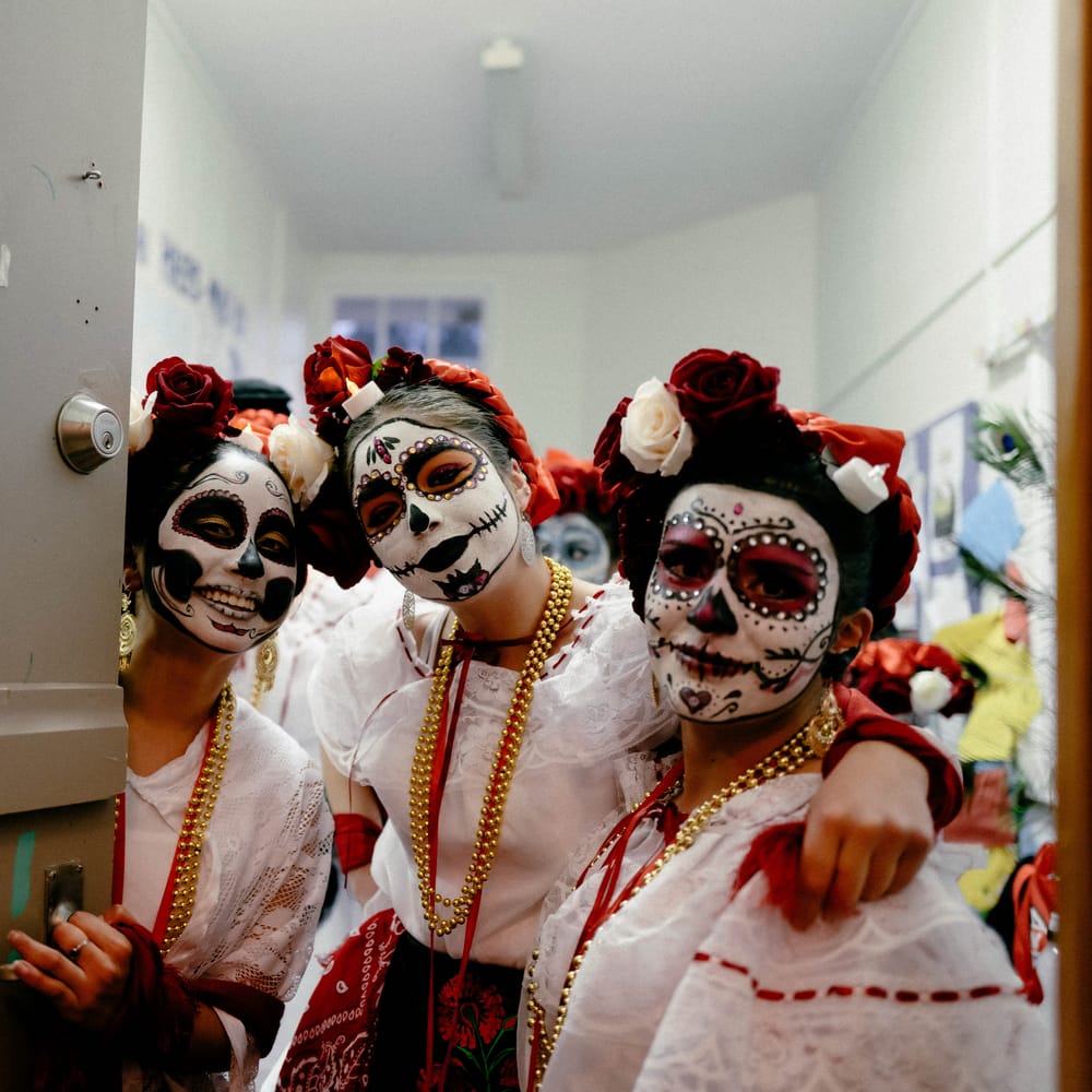 Three women in Day of the Dead costumes post image