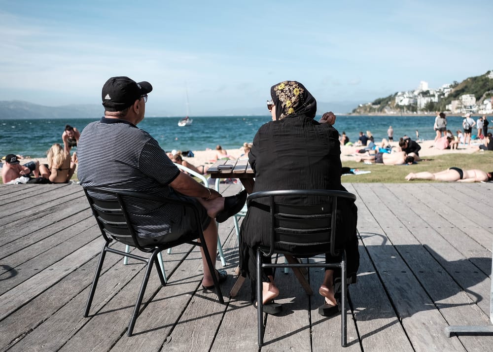 Two seated figures on a sunny deck post image