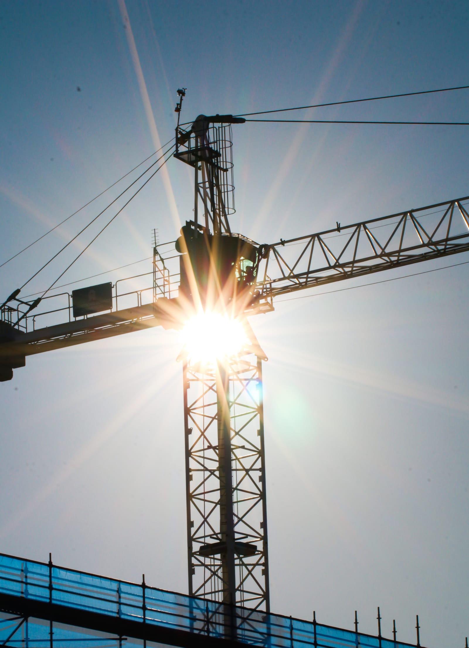 Sunburst through crane structure