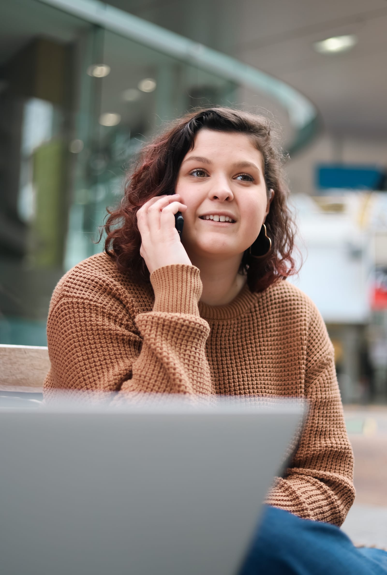 Woman talking on phone outdoors