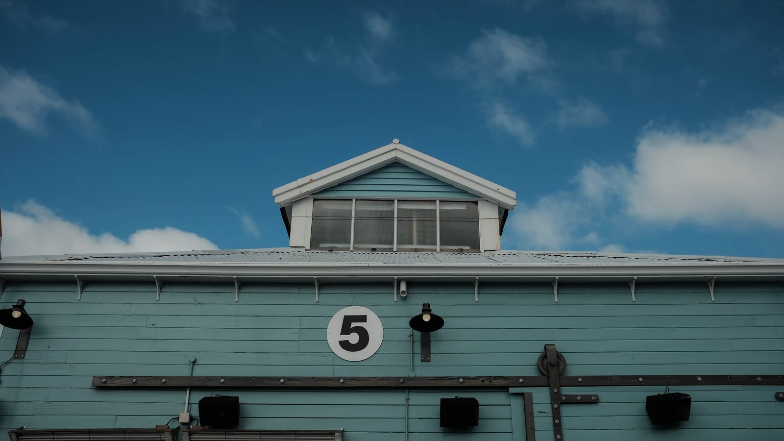 Light blue building with number 5