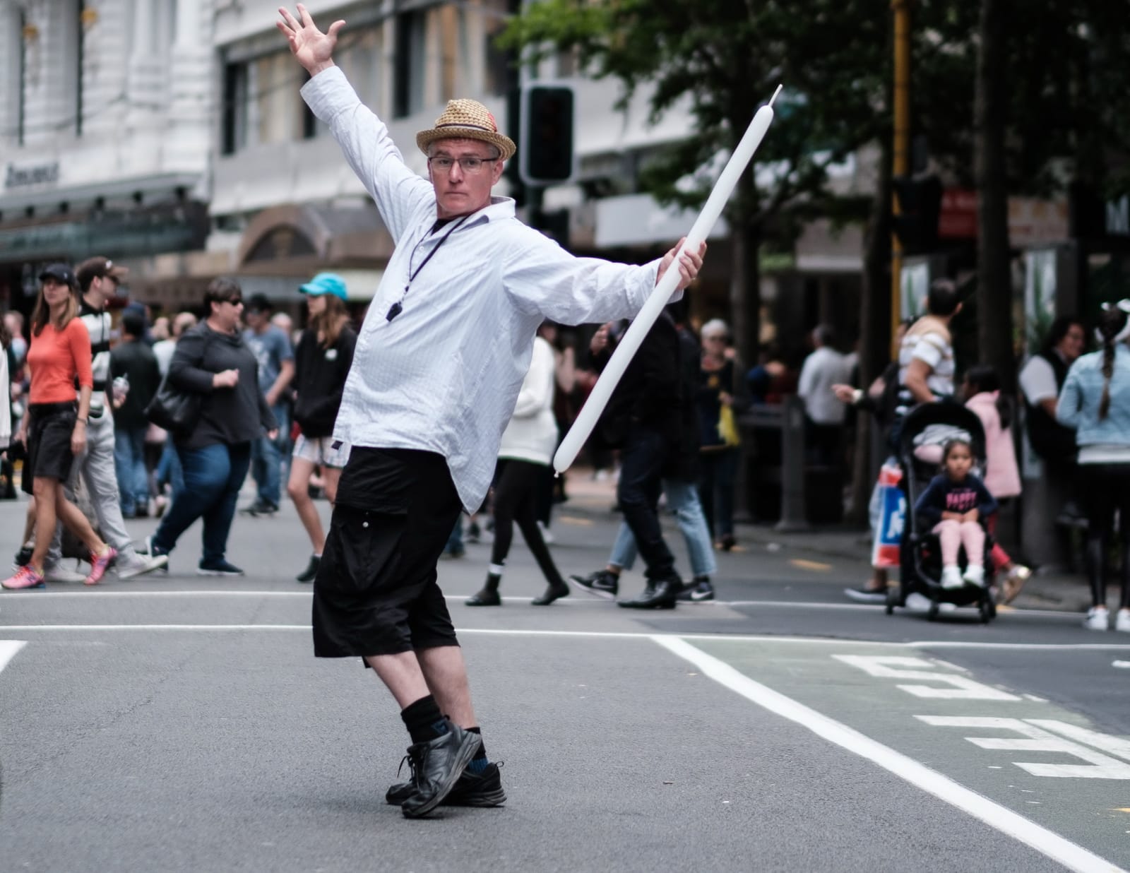 Street performer posing with a balloon