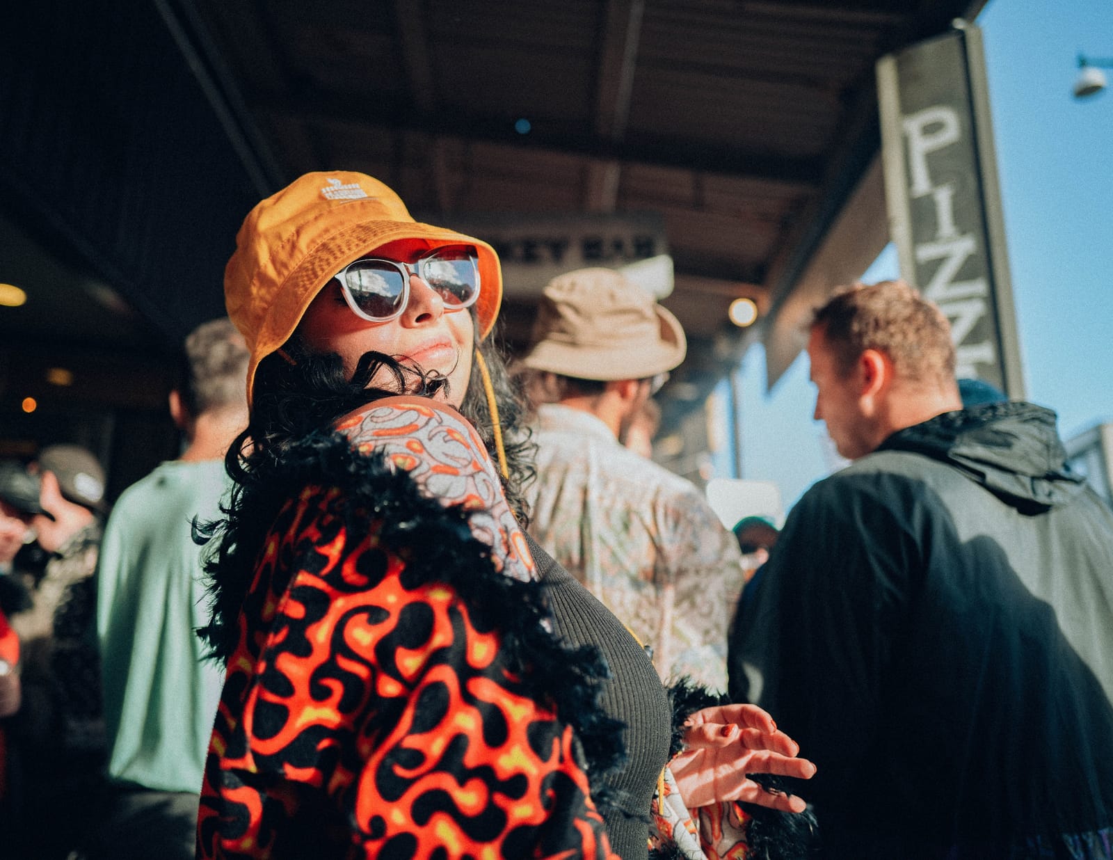 Street portrait with orange hat