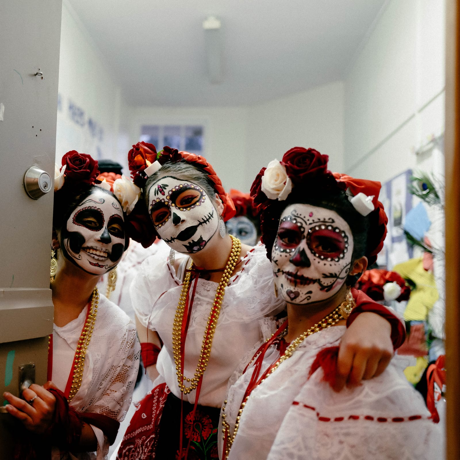 Three women in Day of the Dead costumes