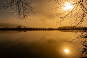 Sunflare at sunrise, Lake Waipori post feature image