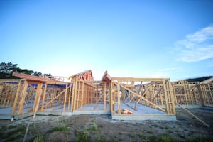 House framing against blue sky post feature image