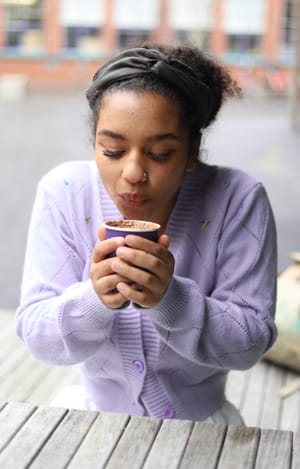 Woman drinking coffee post feature image