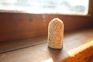Lewis Chess Pawn on Wooden Surface post feature image