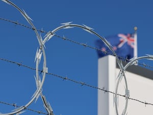 Razor wire and flag post feature image