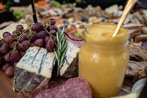 Charcuterie board with blue cheese and grapes post feature image