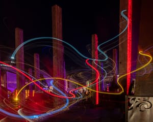 Swirly lights along the pillars at night post feature image
