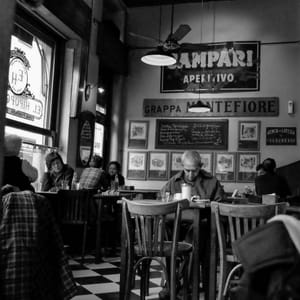 Vintage café interior with patrons post feature image